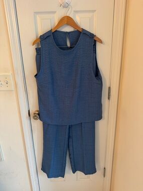 Sleeveless Blue Wide-Leg Jumpsuit with Button-Shoulder Detail